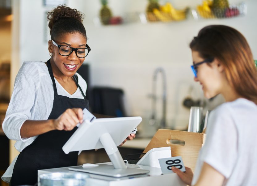 Small business owner with customer