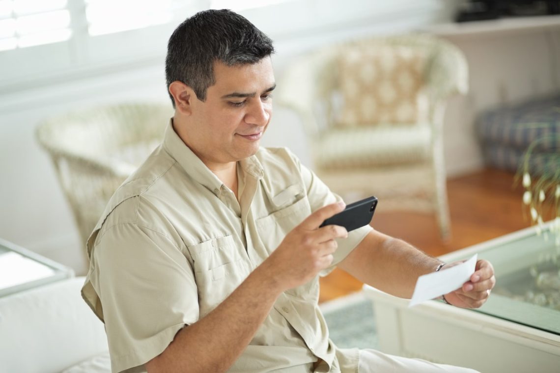 Man using mobile deposit